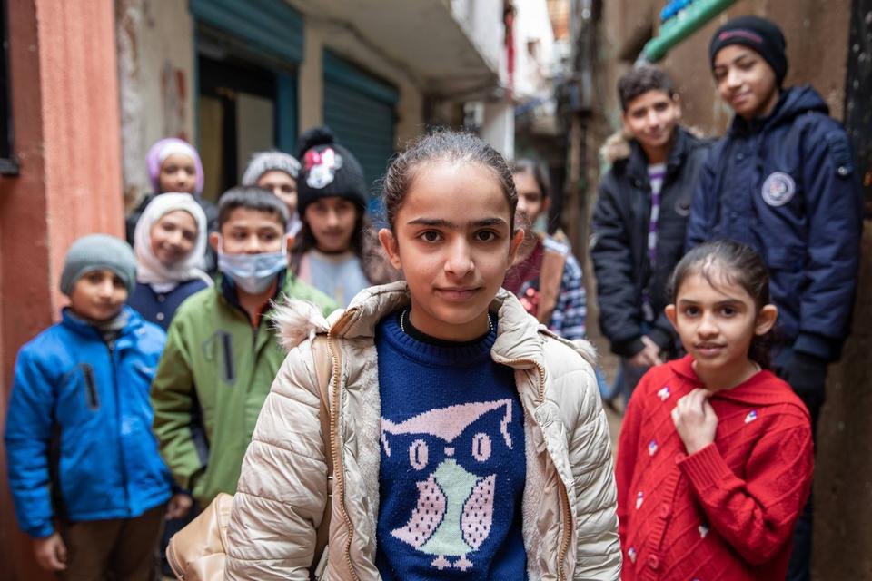 Ghinwa*, 13, with her Child Rights & Governance group in a refugee settlement in Beirut, Lebanon