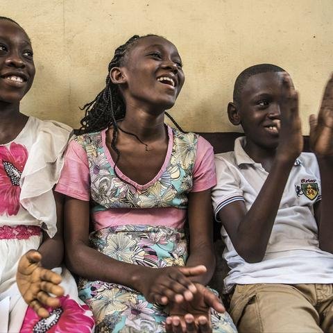Justice (centre) 11, has come to get her Yellow Fever vaccination.