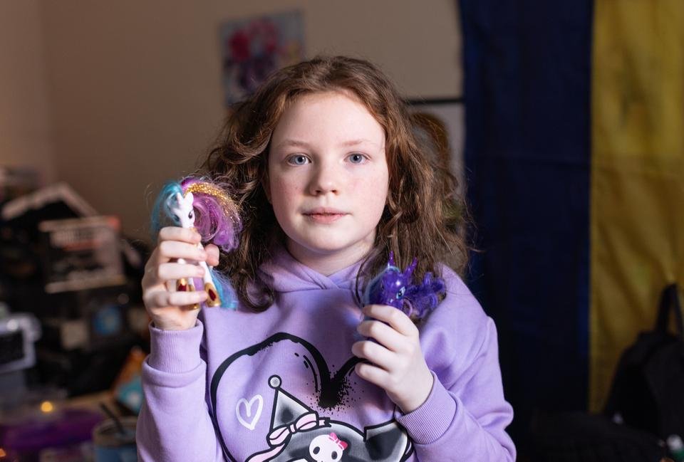 A portrait of Eipril, 11,  with the My Little Ponies she brought on the journey from Ukraine, at her home  near Margate, Kent