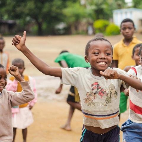Children in Madagascar run and laugh