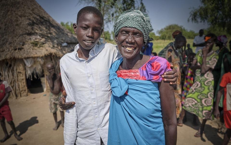 Domaac*, 14, and his mother - SCUK Edit