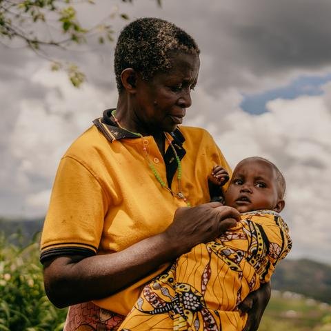 Grandmother Angel*,60, holding 15-month-old granddaughter Christelle*