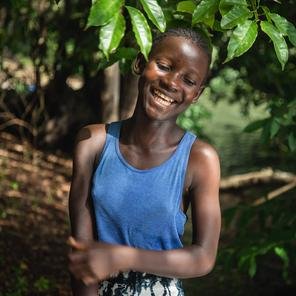Tenneh stands in a garden in Sierre Leone