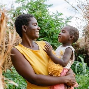 Elizabeth and her daughter Chefuniro, three, at their family garden in Balaka district, Malawi.