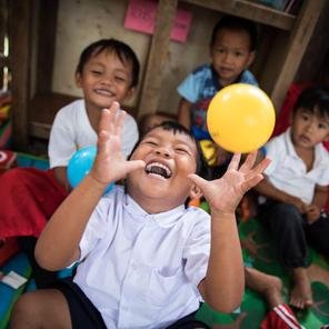 Children playing with balloons
