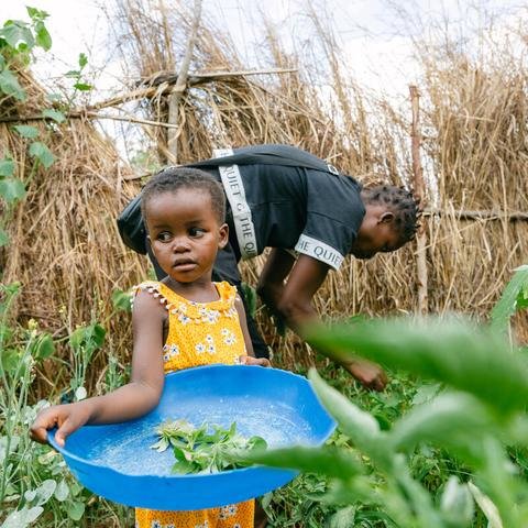 Mary and her daughter Flocy, three, at their family garden in Balaka district, Malawi.