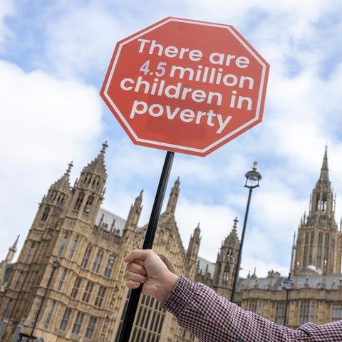 Campaigners from The End Child Poverty Coalition (ECP) & Child Poverty Action Group (CPAG) at a stunt to highlight government stats that shows child poverty in the UK is rising.
