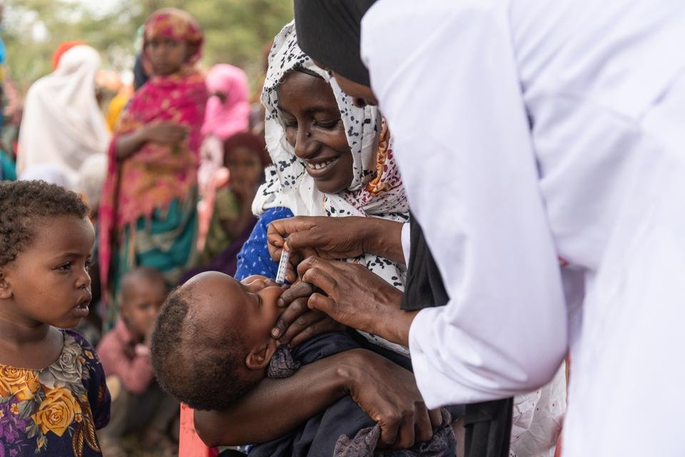 Health worker Miraha, 25, vaccinates Iftine, 7 months, at a mobile outreach session in a remote community in Oromia Region, Ethiopia.