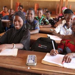 Awa, 11, and Mariam, 10, participating in a class